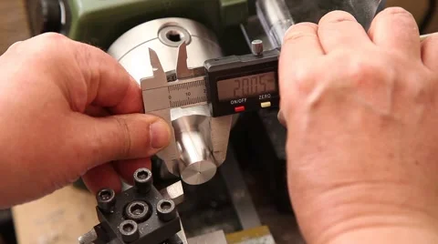 Man using micrometer clock precision dial test indicator gauge scale Stock Footage 64722211