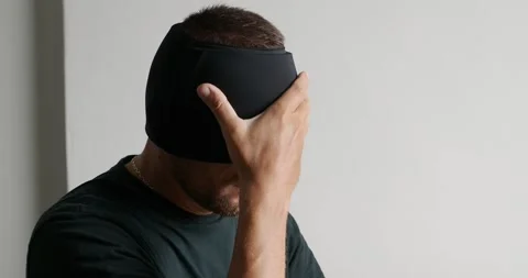 Man using Migraine Relief Cap, Cooling Gel Hat during headache migraine. Video stock 274425595