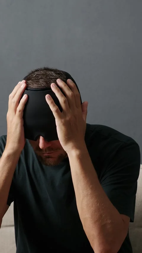 Man using Migraine Relief Cap, Cooling Gel Hat during headache migraine. Stock Footage 275005073