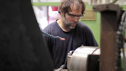 Man using a milling machine in a cnc factory Stock Footage 258980244