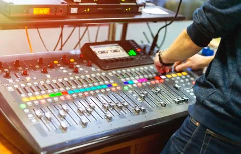 Man using mixing console in sound recording studio Stock Photos