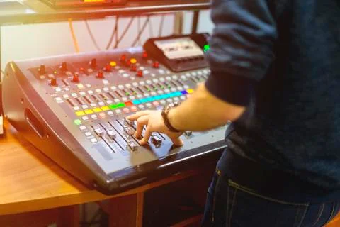 Man using mixing console in sound recording studio Stock Photos