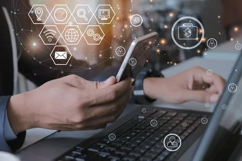Man using mobile and laptop Business technology and data customer connection. 写真素材