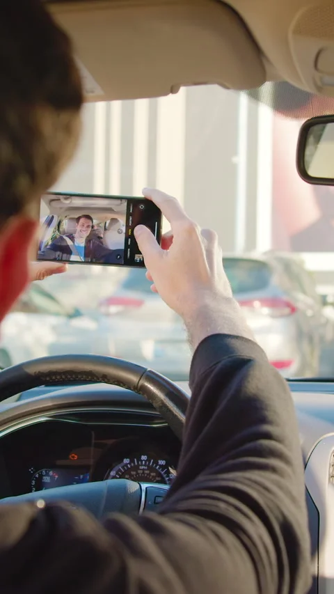Man using mobile app to unlock rental car while seated in vehicle, showcasing Video stock 319944988