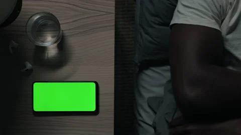 Man using mobile with green screen for turning off lights Stock Footage 161312468