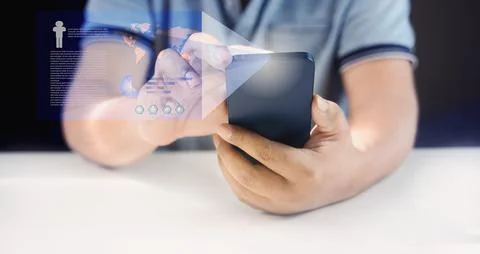 Man using mobile phone in accessing personal data via the Internet Online 库存照片