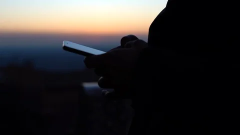 Man using mobile phone, browsing internet, chatting online and reading news Stock Footage 129464871