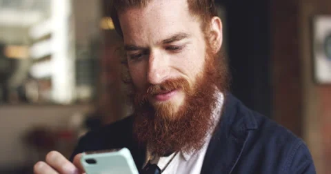 Man using mobile phone in cafe is happy hipster Stock Footage