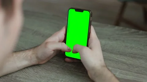 Man using a mobile phone with chroma key green screen Stock Footage 202276569