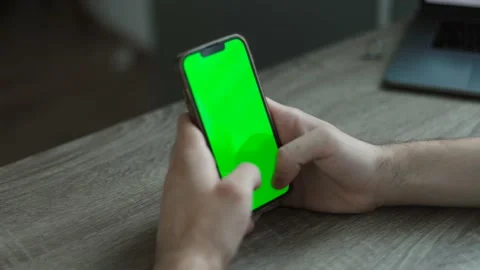 Man using a mobile phone with chroma key green screen Stock Footage 202276622