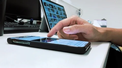 Man using mobile phone close-up hands at his office on the desk. Stock Footage 121548903
