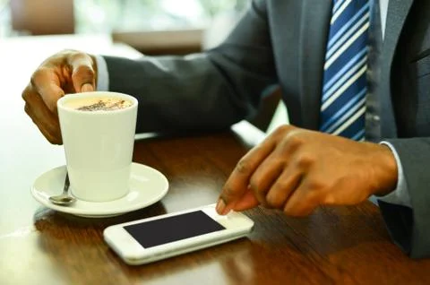 Man using mobile phone in the coffee shop Foto stock