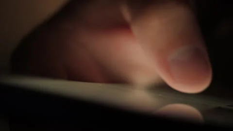 Man Using Mobile Phone in Dark. Finger Scrolling on Screen. Close-up Finger.. 스톡 동영상 308934717