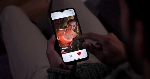 Man using mobile phone dating app at home Stock Footage 147403104