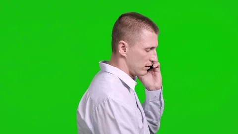 Man using mobile phone on green screen. Side shot. Stock Footage 105305475