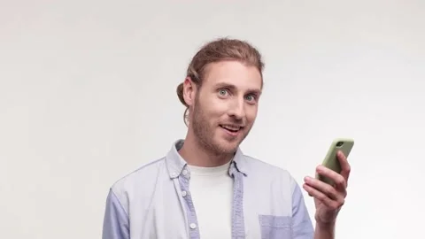 Man using mobile phone hold fan of cash money in dollar banknotes. Boy hold fan Stock Footage 164268248