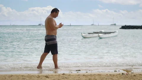 Man using a mobile phone in Honolulu Hawaii in 4k slow motion Stock-Footage 87352847