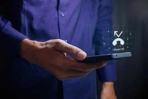 Man using a mobile phone with with missed call notification on the virtual .. Stock Photos