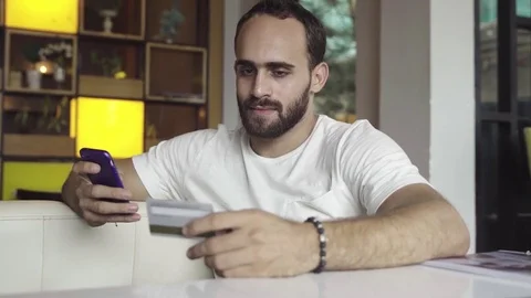 Man using mobile phone for online shopping with credit card Stock Footage 83019809