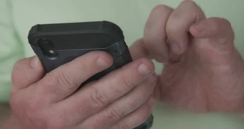 Man using mobile phone for scrolling feeds and navigating. Stock Footage 190381534