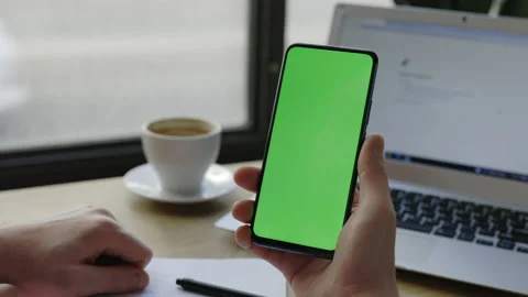 Man using mobile phone vertical green screen. Chroma key and mock up. Stock Footage 170720877