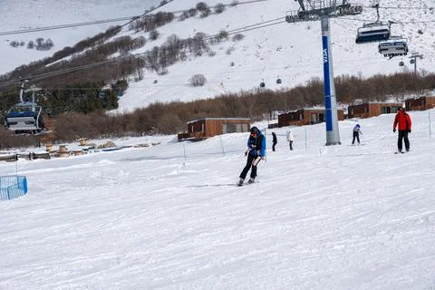 A man using mobile phone while skiing at Myler Mountain Resort Stock Photos