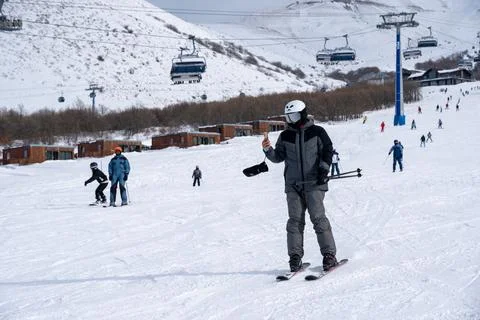 A man using mobile phone while skiing at Myler Mountain Resort Stock Photos