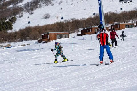 A man using mobile phone while skiing at Myler Mountain Resort Stock Photos