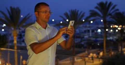 Man Using Mobile Phone Writing Online People Crowd Shopping Evening Night Light Stock Footage 76998831