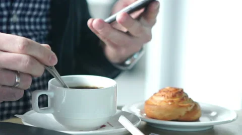 Man using mobile smart phone with coffee outdoors. Stock Footage 58506627