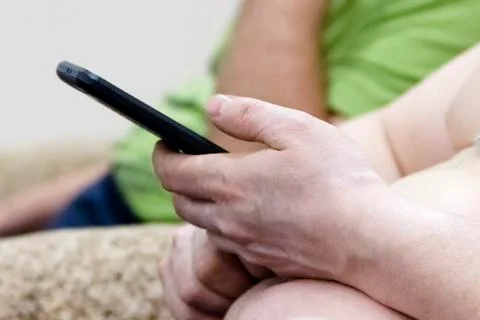Man using mobile smart phone with blank white screen Stock Photos