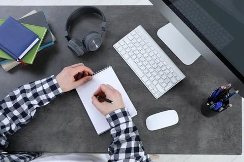 Man using modern computer for studying at table, top view. Distance learning Stock Photos