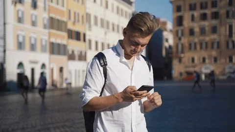 Man using modern technology smartphone and browsing the internet staying in the 스톡 동영상 112352989