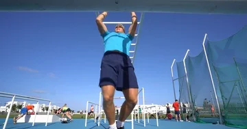 A man using Monkey Bars on Street Fitness Circuit. 스톡 동영상 85538305