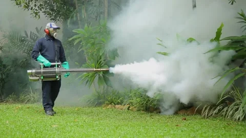 Man using a mosquito repellent smoke machine Video stock 288233058