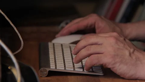 Man using Mouse and Working on PC on a Wood Desk. 動画素材 136137220