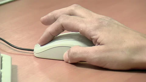 A Man Using the Mouse of an Old Personal Computer. Close Up. Stock Footage 250201905