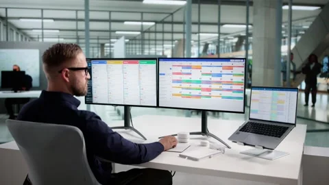 Man Using Multiple Screens In Office For Kanban Stock Footage 320251743