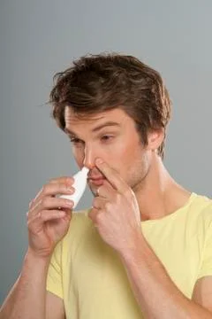 Man Using Nasal Spray Stock Photos