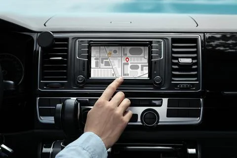 Man using navigation system while driving car, closeup Stock Photos