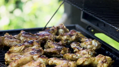 Man using new barbecue for a first time Stock Footage 139162490