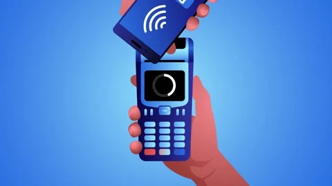 Man using NFC technology from his mobile phone to make a payment Stock Footage 259464690