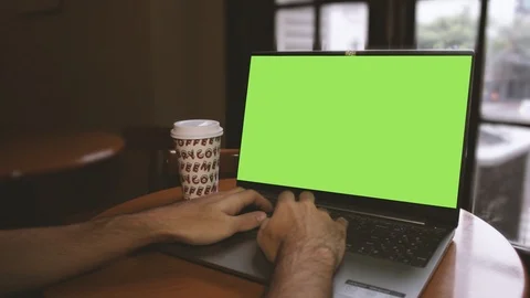 Man using a notebook in a cafeteria Stock Footage 125347291