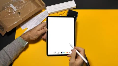 Man using Notes App on latest iPad pro with Apple Pencil Stock Photos