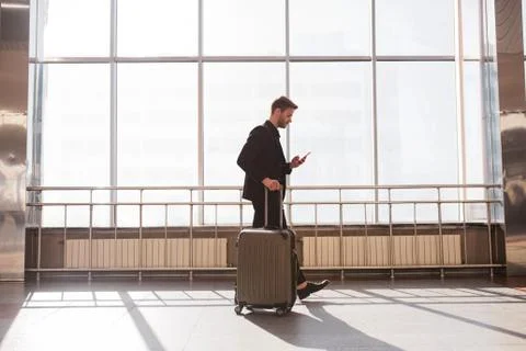 Man using a novel navigaion app in the airport Stock Photos