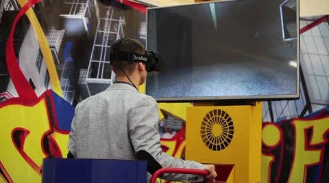 Man using Oculus virtual reality glasses in video game in game center Stock Footage 61091174