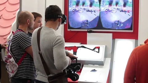 Man using Oculus virtual reality glasses in video game in game center Video stock 80897867