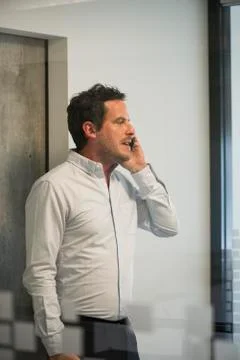 Man using office telephone Stock Photos