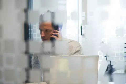 Man using office telephone Stock Photos