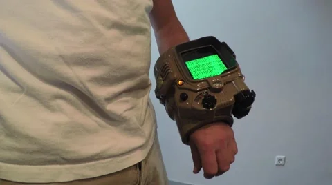 Man using old looking home made smartwatch first booting up the device 4k Stock Footage 56994125